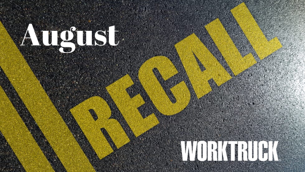 Pavement background with double yellow lines and large text that says Recall, August, and Work Truck logo.