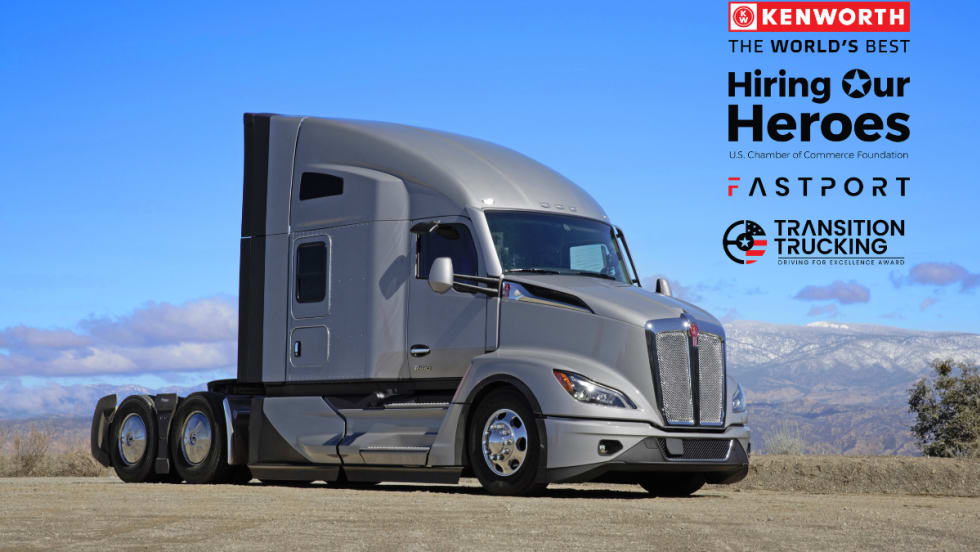 Kenworth T680 truck with Transition Trucking, Hiring Our Heroes, and Fastport logos for 2025 veteran driver award.