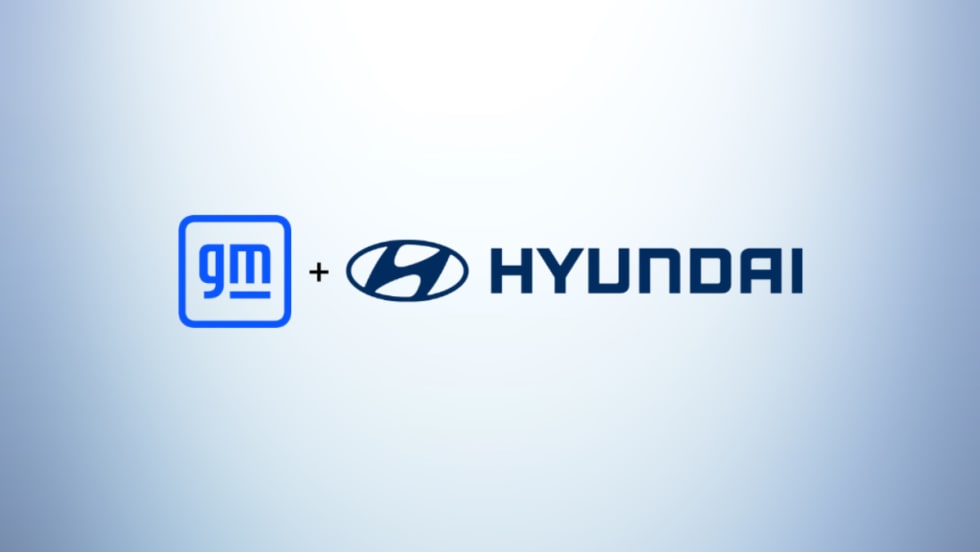 General Motors and Hyundai logos side by side on a light blue gradient background, representing a collaboration between the two automakers.