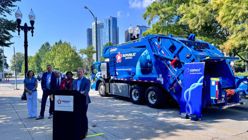 Speakers stand in front of Republic Services’ new Mack LR Electric refuse truck at a Chicago launch event with ComEd and Mack Trucks.