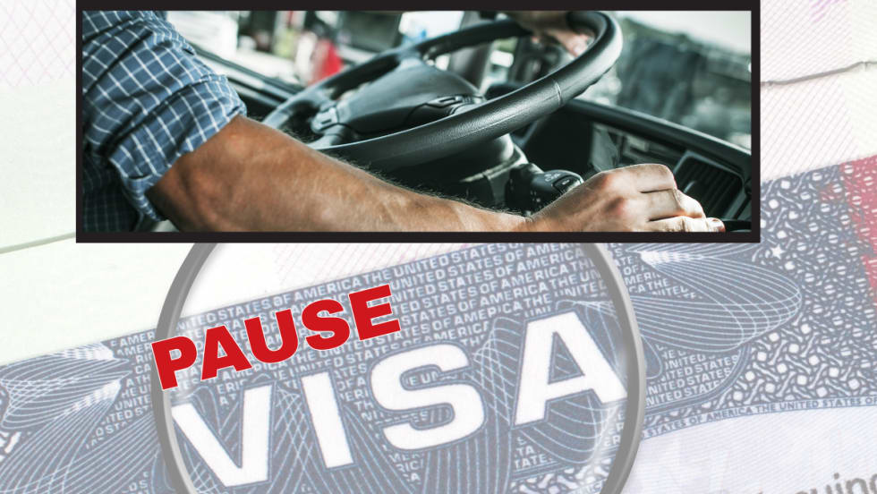 Background image of a VISA, with red headline stating Pause, and inset image of truck driver hands on wheel.
