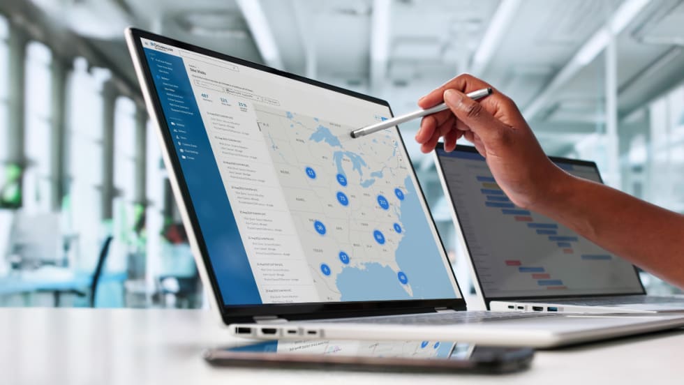 Drivewyze Safety+ Site Visits Map View displayed on a laptop, showing U.S. fleet safety events and hotspots for managers to monitor risks and driver activity.
