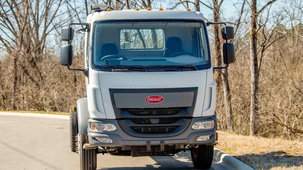 Interior view of a Peterbilt Model 220 cab featuring Fontaine’s dual-drive steering setup with two steering wheels—one on the left and one on the right side of the cab.