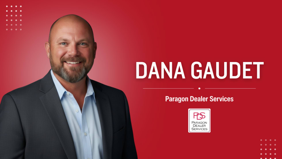 Portrait of Dana Gaudet, the new controlling owner of Paragon Dealer Services, standing in front of a red background with the company’s logo.