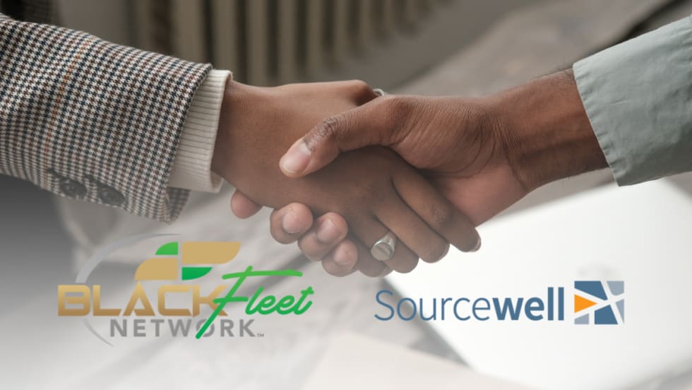 Two people shake hands representing a new partnership between Black Fleet Network and Sourcewell to strengthen fleet education and professional growth.