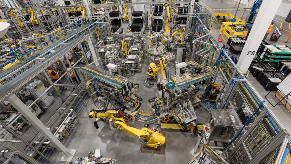 Robotic equipment operates on the production floor at GM’s CAMI Assembly plant in Ontario, where BrightDrop electric delivery vans were built before production ended.