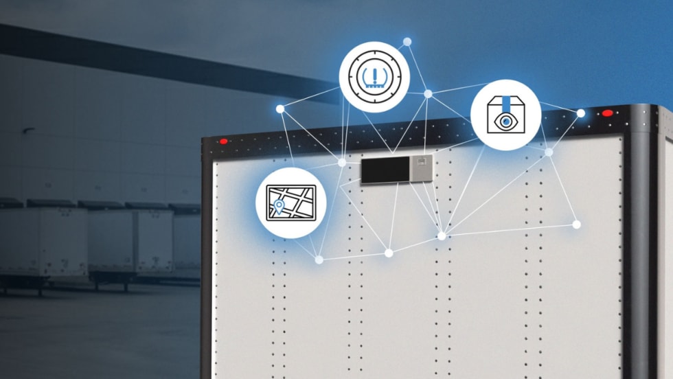 Close-up of a trailer equipped with Phillips Connect SolarNet 8000 Series showing connected icons for GPS tracking, cargo monitoring, and tire pressure data.