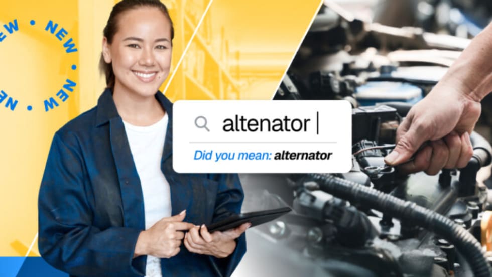Technician using a tablet with an automotive search screen showing the word “altenator” corrected to “alternator,” representing Mitchell 1’s new “Did You Mean” feature.