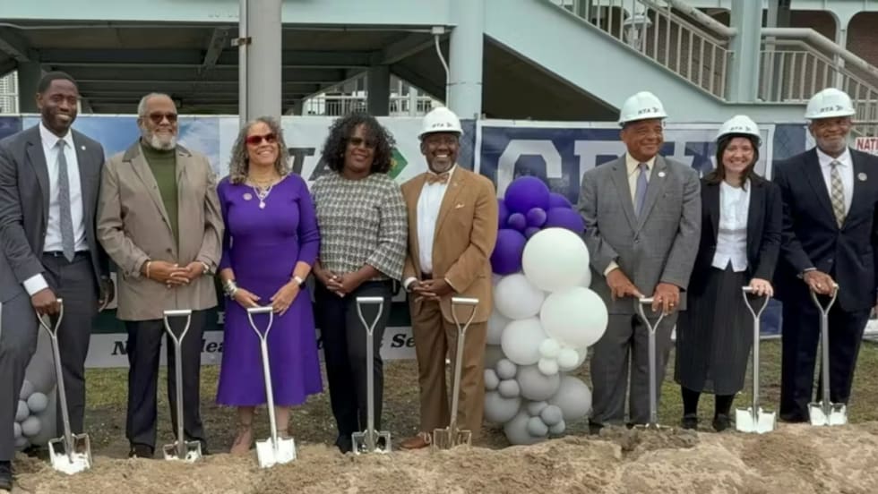 RTA and local officials in hard hats hold shovels at the Algiers Ferry Terminal groundbreaking.