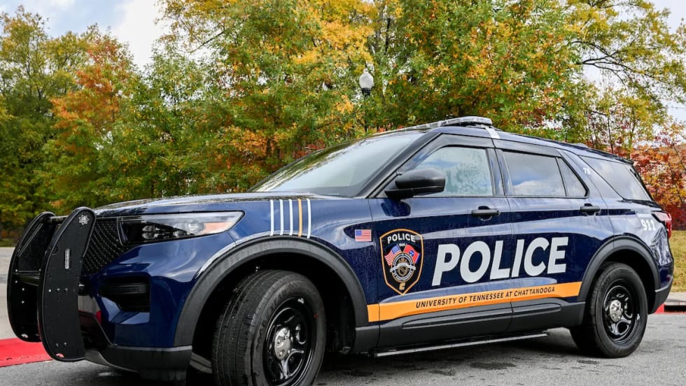 University of Tennessee at Chattanooga Police SUV parked outdoors, displaying updated blue-and-gold graphics, police markings, and university identification.