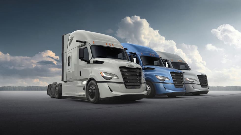 Three Freightliner fifth-generation Cascadia trucks are shown parked in a lineup, highlighting exterior design and aerodynamic styling.