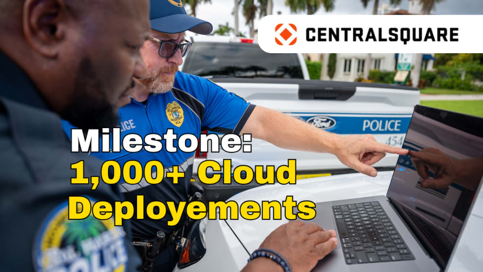 Image of two police officers working on a laptop with logo for CentralSquare and headline Milestone: 1,000+ Cloud Deployments.