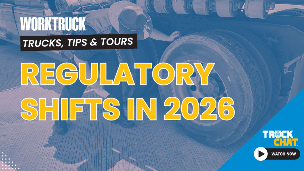 Background image of an officer inspecting a commercial truck's tires with headline Regulatory Shifts in 2026 and logos for Work Truck and Truck Chat. 
