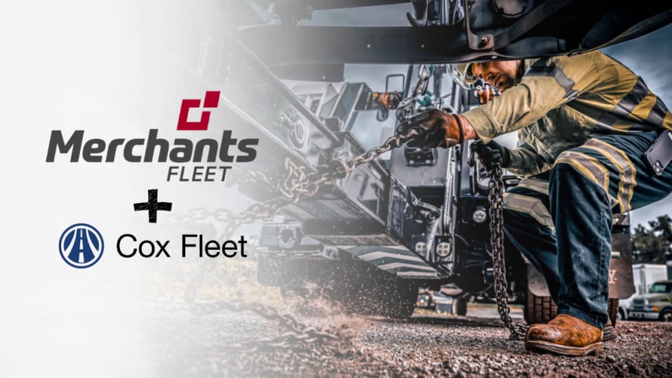 Technician securing chains on a work truck as Merchants Fleet and Cox Fleet announce an expanded partnership to support nationwide fleet maintenance and roadside service operations.