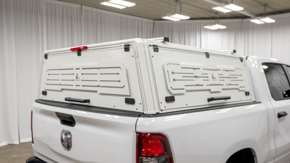 White truck cap cover installed on a white pickup truck. 