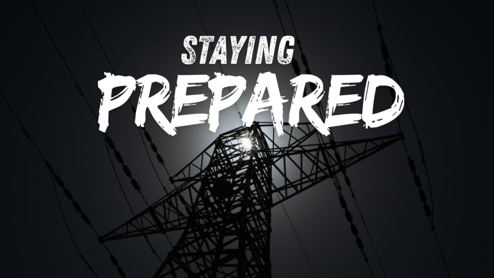Blackout photo of a powerline with STAYING PREPARED on top