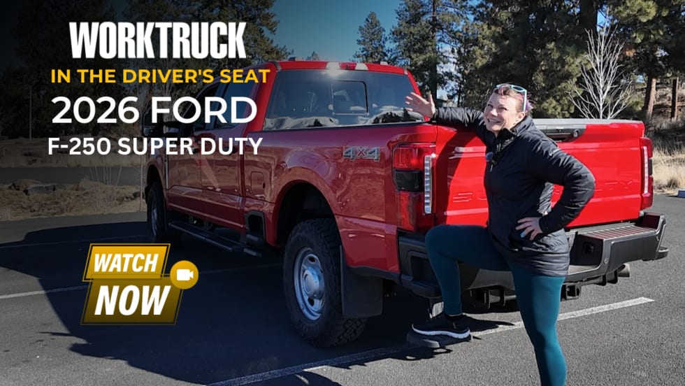 Woman stepping into a red 2026 Ford F-250 Super Duty in a parking lot, highlighting entry height and driver accessibility for a heavy-duty work truck.