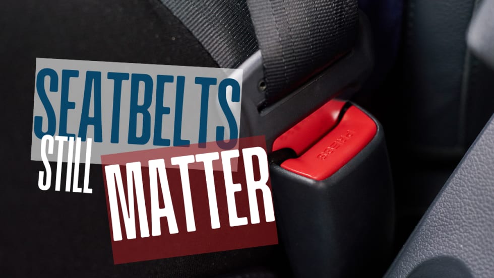 Close-up of a seatbelt buckle fastened in a vehicle, highlighting the importance of seatbelt use for driver and passenger safety.
