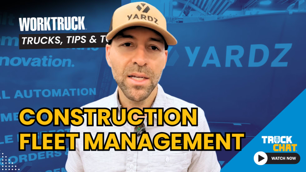 Man wearing a brown ballcap talking in front of a tradeshow sign for YARDZ, logos for Work Truck and Truck Chat, and headline Construction Fleet Management.