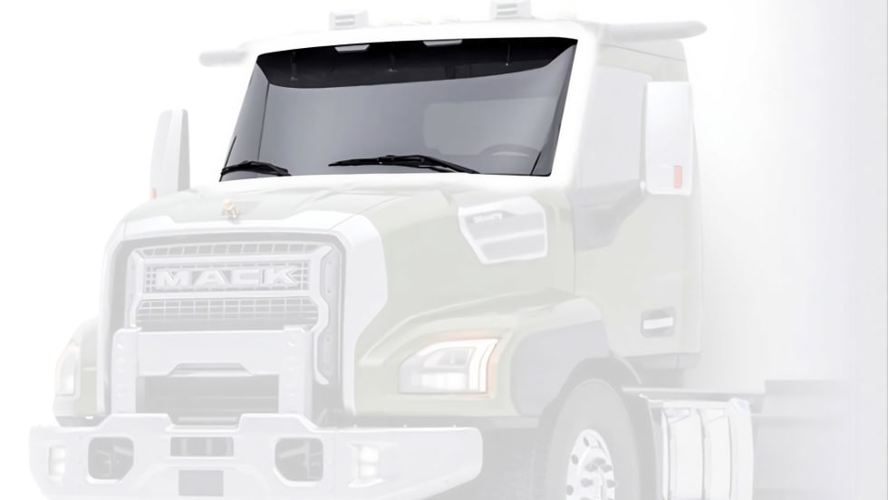 Front view of a Mack Granite heavy-duty truck featuring the new ImpactShield windshield with Corning Fusion5 Glass technology.