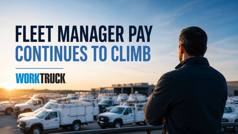 Fleet manager overlooking a lot of work trucks at sunrise, representing rising pay and growing demand for fleet leadership roles.