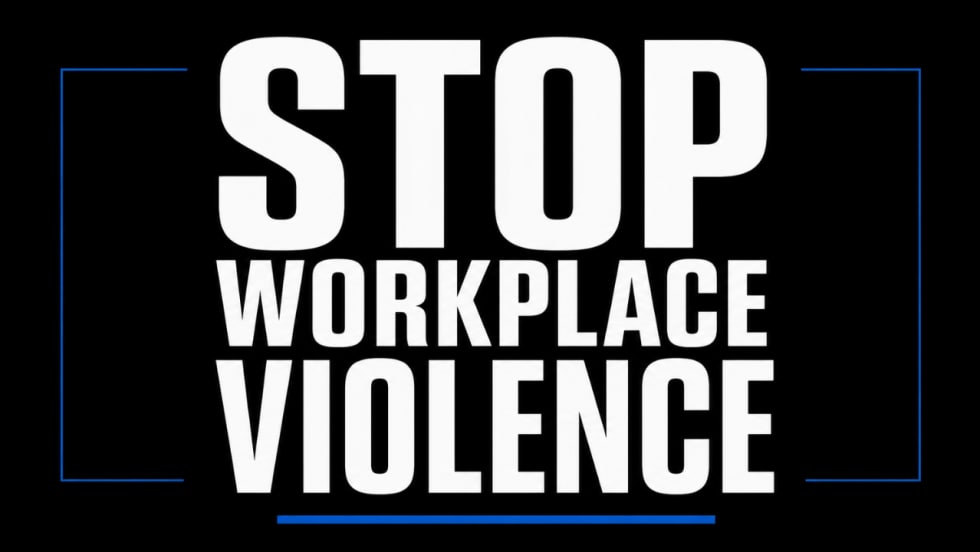 Black graphic with large white text reading “Stop Workplace Violence” framed by blue accent lines.