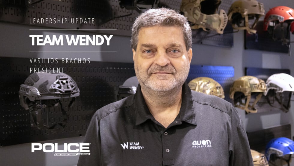 Leadership update graphic featuring Team Wendy President Vasilios Brachos standing in front of a display of protective helmets, with POLICE Law Enforcement Solutions branding and text announcing his appointment as company president.