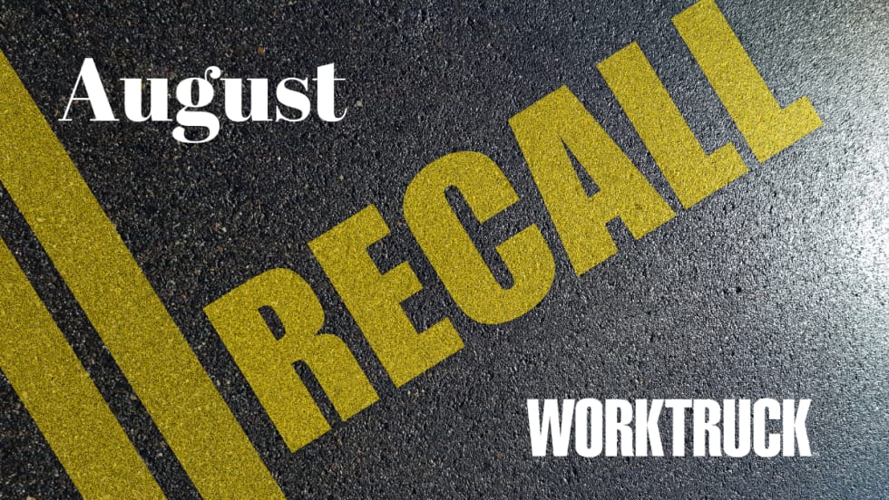 Pavement background with double yellow lines and large text that says Recall, August, and Work Truck logo.