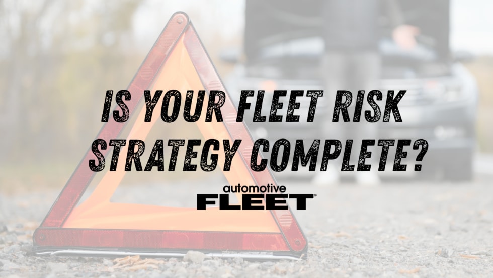 Emergency warning triangle in the foreground with a disabled vehicle and driver blurred behind it. Text reads, “Is Your Fleet Risk Strategy Complete?” with the Automotive Fleet logo.