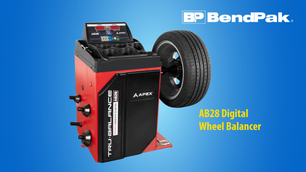 BendPak APEX AB28 digital wheel balancer shown with a mounted tire, featuring a red-and-black cabinet, digital control panel, and multiple wheel adapters against a blue background.