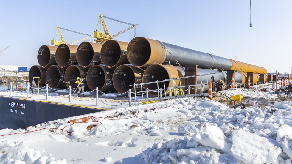 A snowy bridge construction staging zone.