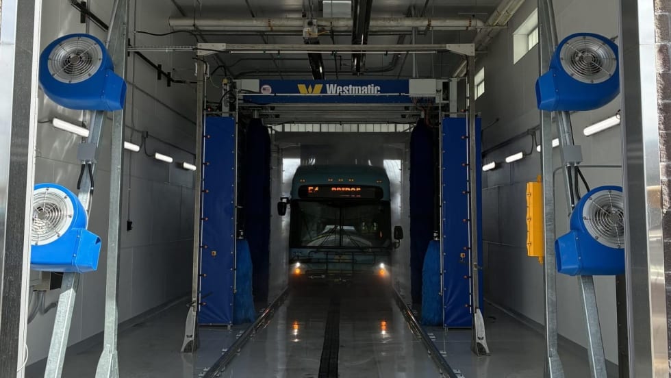 An ABQ RIDE bus going through a Westmatic wash system.