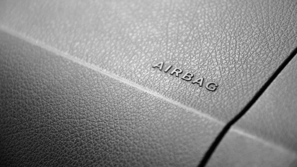 Photo of "airbag" term on car dashboard