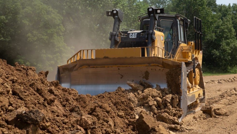 Caterpillar Cat D8 XE dozer operating on a dirt worksite, part of the company’s next-generation lineup featuring Electric Drive technology to improve efficiency and performance.