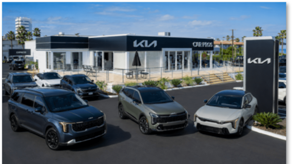outside of car dealership with cars parked in front