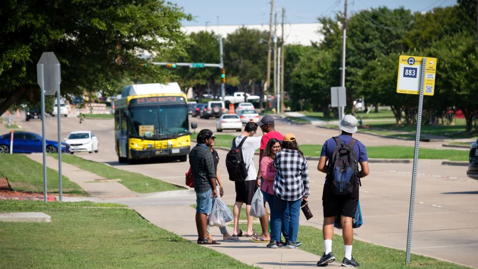 DART bus approaching waiting passengers