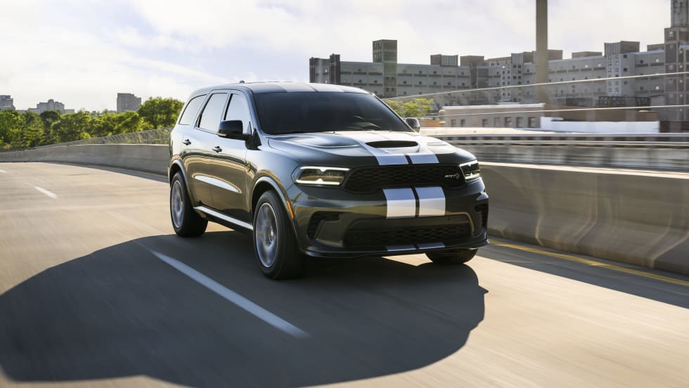 Photo of Dodge Durango moving down a road in sunlight