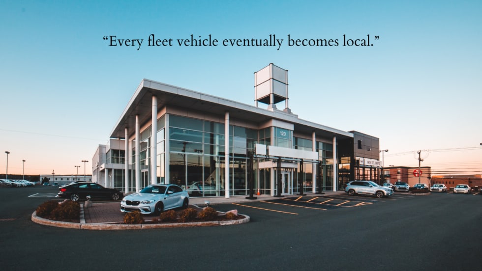A car dealership with added inscription "Every fleet vehicle eventually becomes local." 