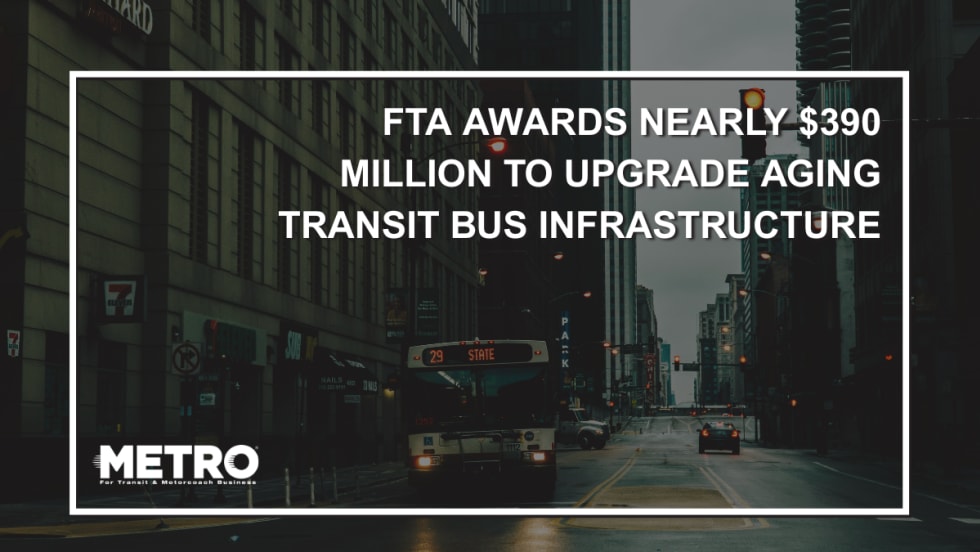 A public transit bus at a pedestrian crosswalk with text reading "FTA Awards Nearly $390 Million to Upgrade Aging Transit Bus Infrastructure Nationwide."