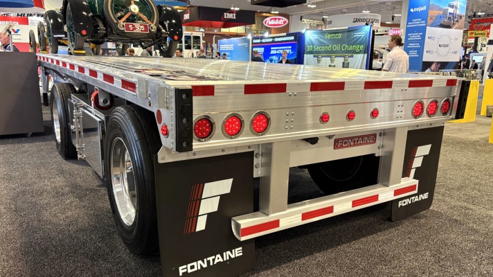 Photo of back of aluminum flatbed trailer on show floor