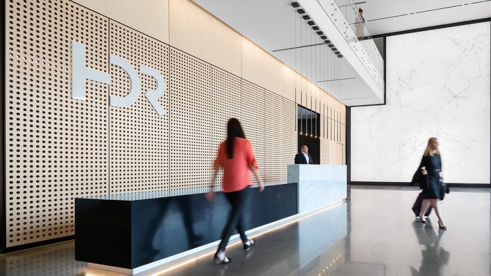 A photo of employees walking through HDR's office.