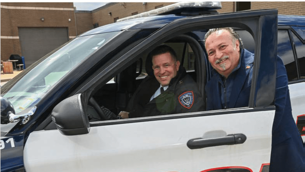 Officer smiling with an executive