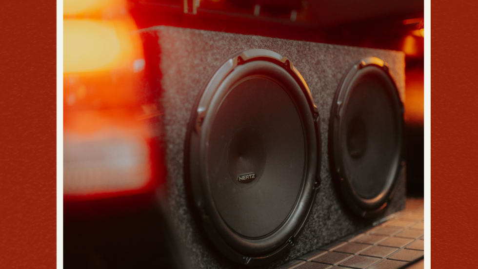 Subwoofer in trunk of car.