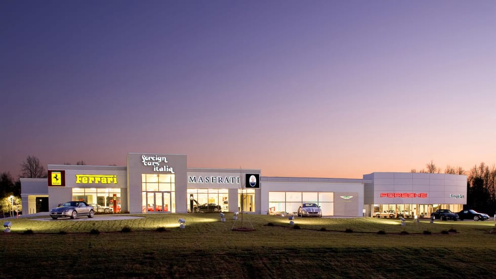 Foreign Cars Italia dealership store in front of sunset