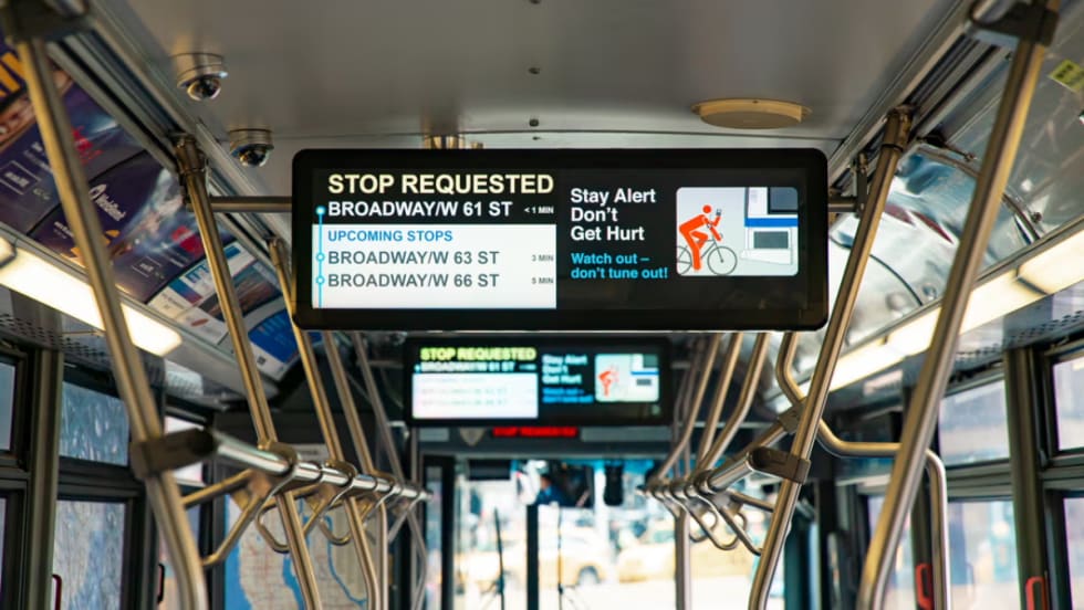 A Hitachi Rail screen on public transit.