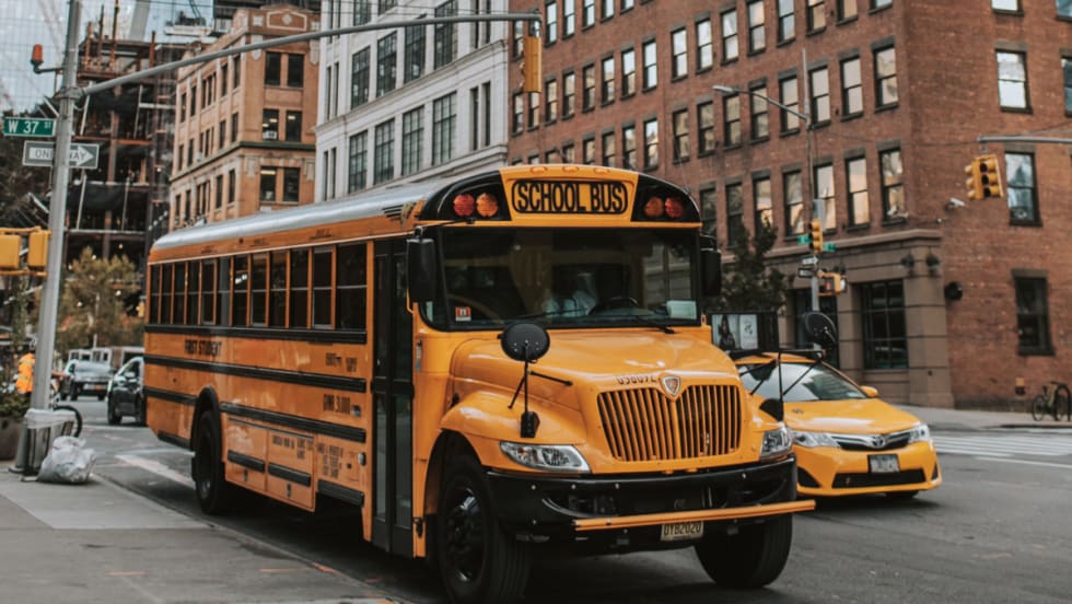 A New York school bus in the street.