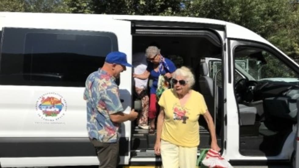 Seniors exiting an OCTA van.