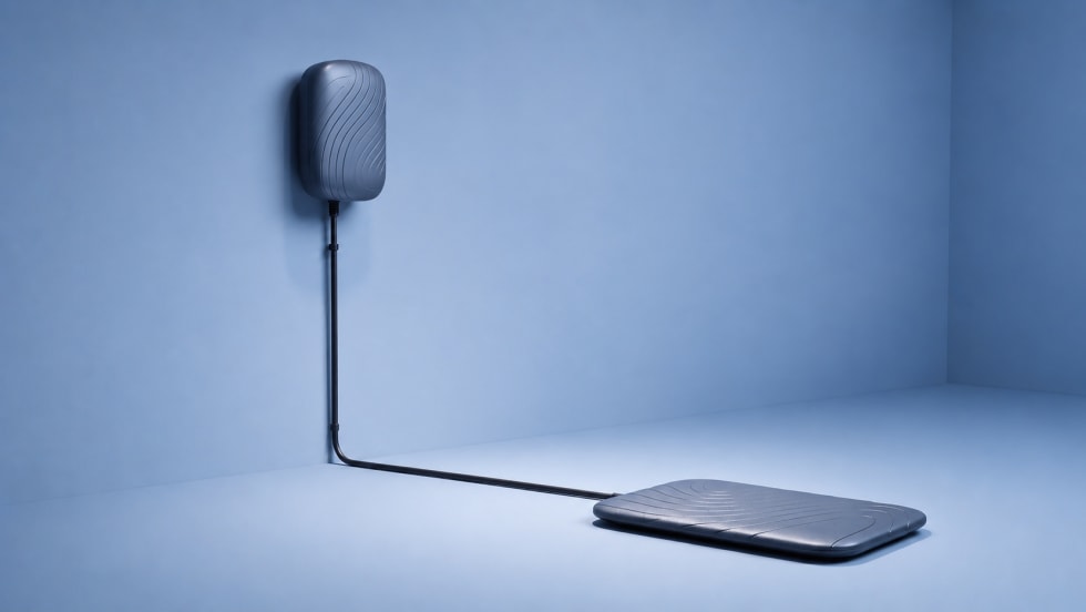 Gray electric vehicle charger unit with pad-like wall and ground pieces connected to each other
