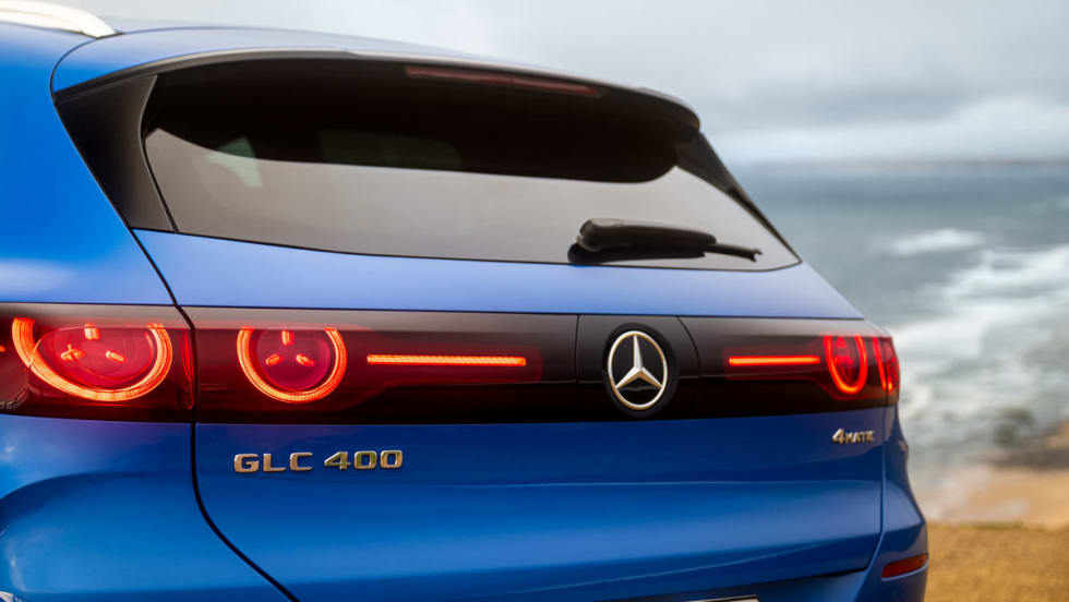 Photo of the rear of a Mercedes GLC 400 electric SUV with a skyline in the background