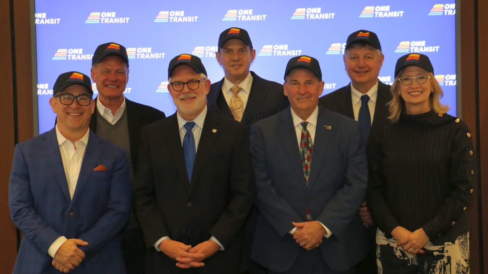 The ONE Transit Board wearing newly branded hats.